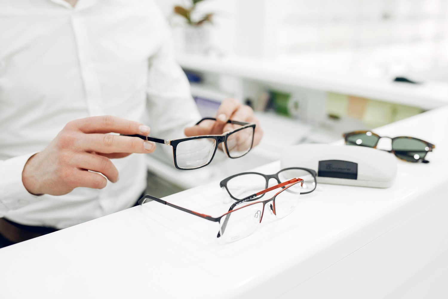 Man in a glasses. Guy in a optics shop